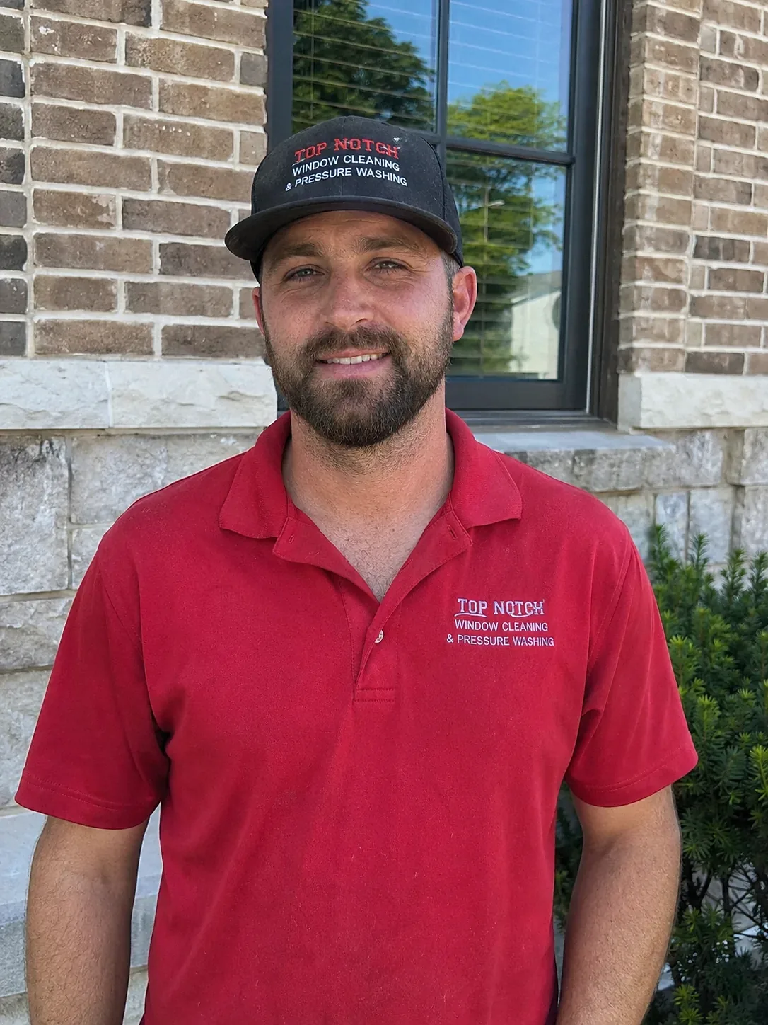 Top Notch Window Cleaning and Pressure Washing uniformed employee in Austin TX